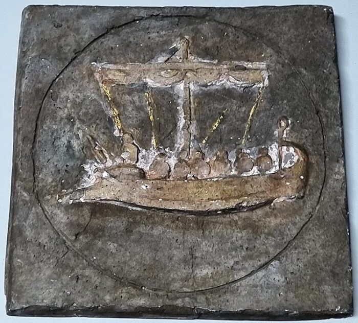 Retro handmade bas-relief stone Phoenician ship