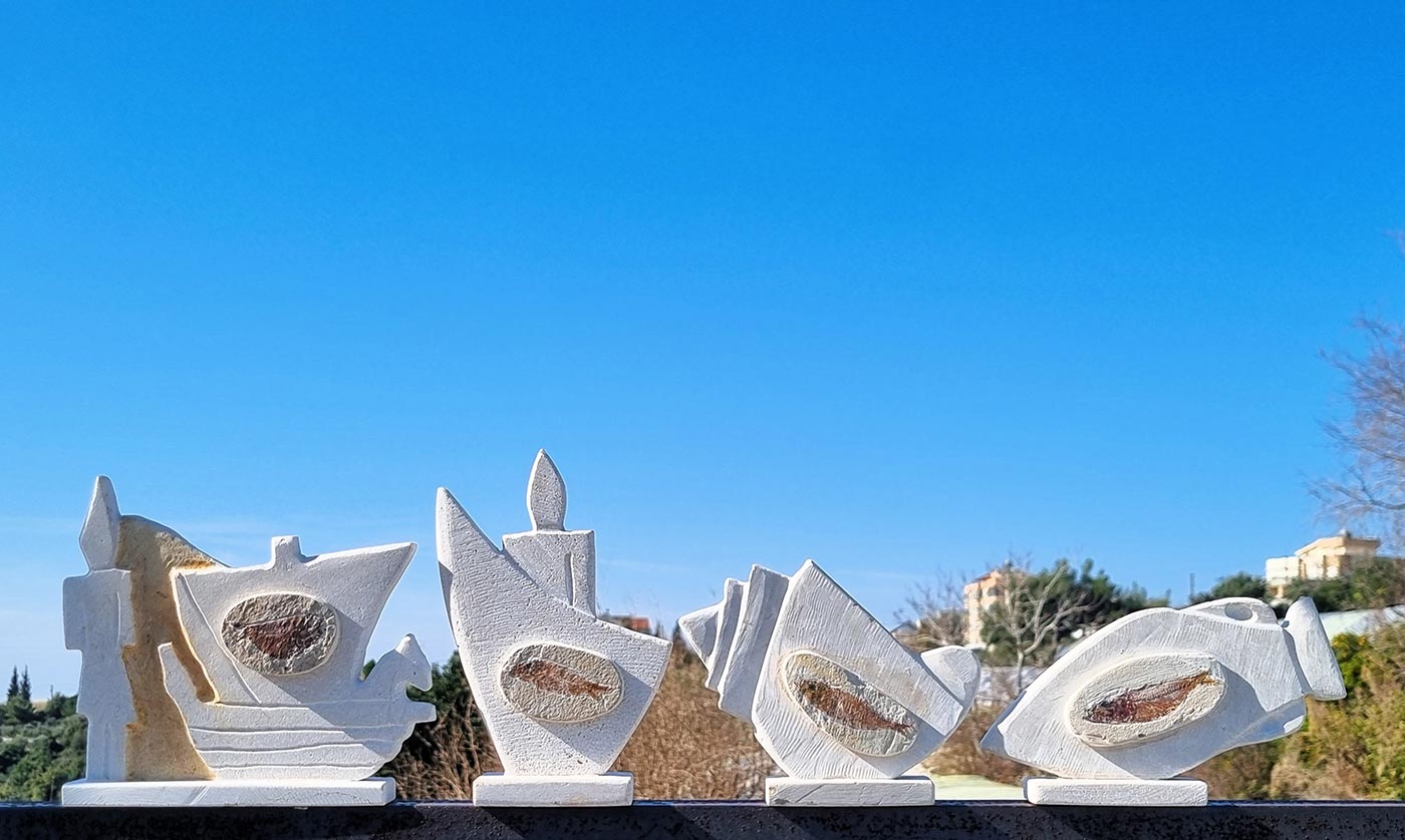 Stone bas-relief sculptures stands, representing the old Phoenician time with a real stone fossil