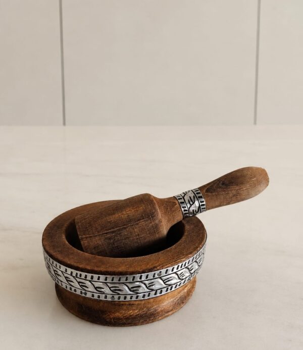 Handmade pestle & mortar decorated with a plate of metal