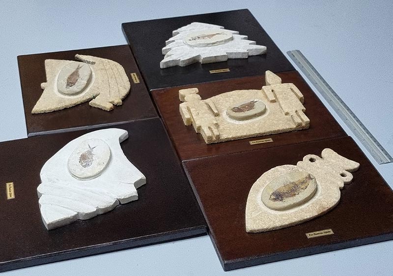 Stone bas-reliefs sculptures on wood, representing old Phoenician