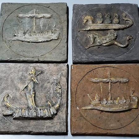 Retro handmade bas relief stone Phoenician ships