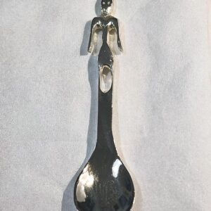 Small sculpted spoon featuring a Phoenician statuette