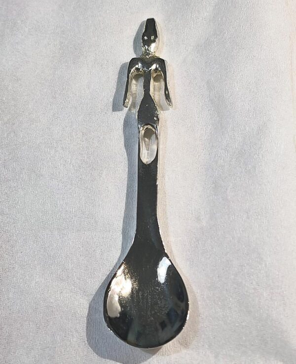 Small sculpted spoon featuring a Phoenician statuette